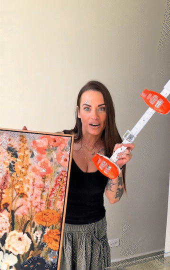 Demonstration of the all-in-one picture hanging tool